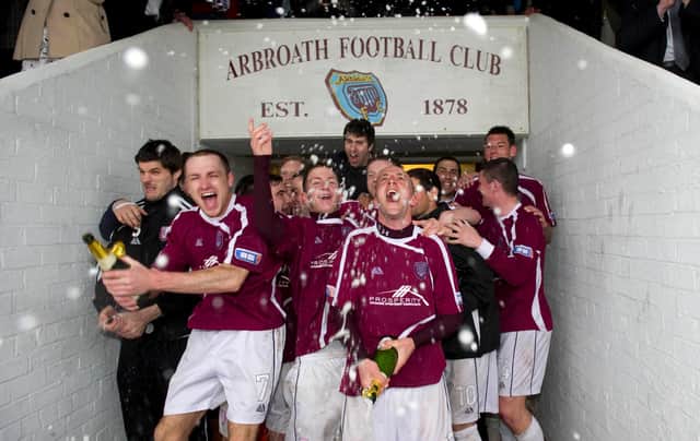 Paul Sheerin (right) leads his Arbroath team celebrations after winning the SFL Third Division (Pic: SNS/Ross Brownlee)
