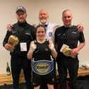 Stephanie pictured with her coaches (Picture: Falkirk Phoenix Boxing Club)