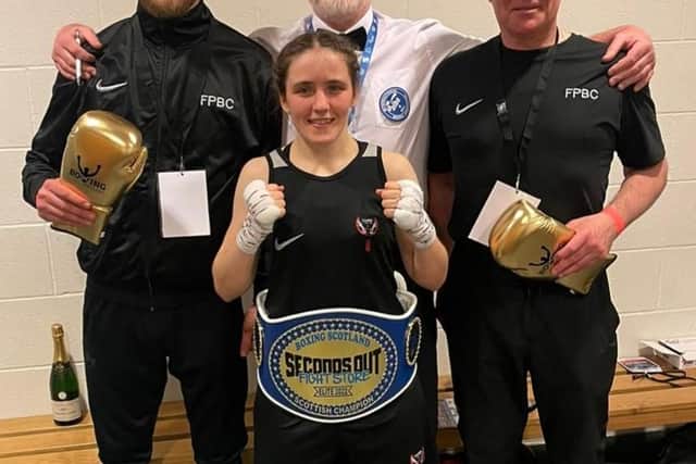 Stephanie pictured with her coaches (Picture: Falkirk Phoenix Boxing Club)