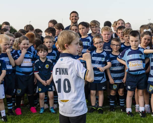 Rory Lawson with a group of young Falkirk RC members, who sent a message to former player Finn Russell ahead of the Scots' World Cup kick-off on Sunday (Photo: Euan Cherry)