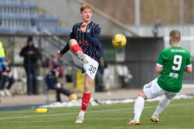 Jevon Mills clears the ball (Picture: Ian Sneddon)