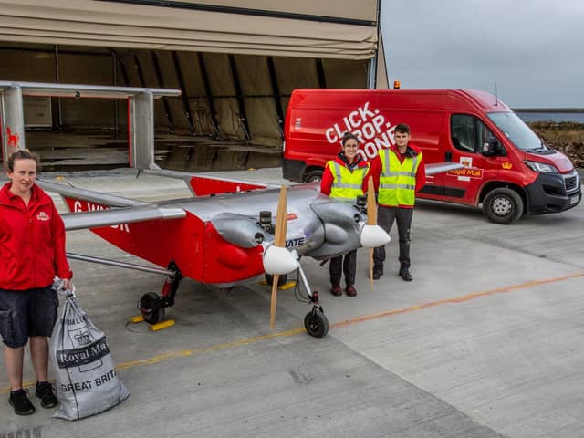 Royal Mail staff with the UAV which will be used for island deliveries