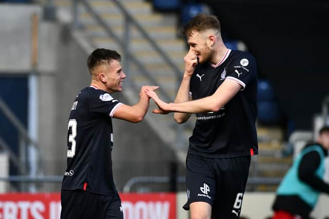 Kennedy celebrate his goal with Coll Donaldson