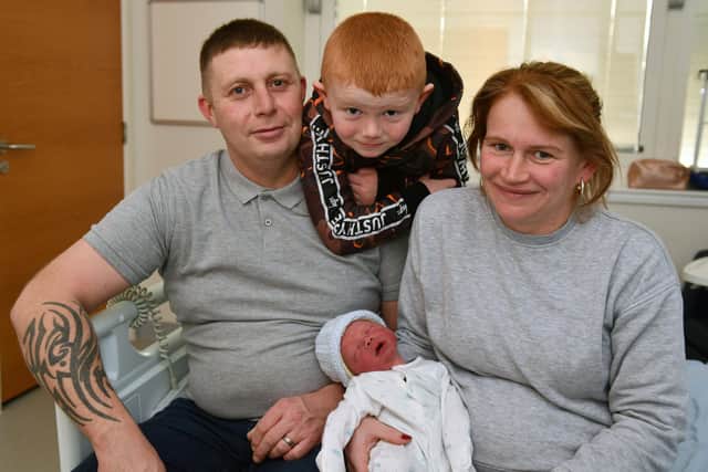 Riley Archer Walker, born on January 1, 2022 with mum Shelley, dad Paul and big brother John, 5.
Pic: Michael Gillen