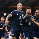 Scotland players mob Callum McGregor after his goal against Croatia (Pic by Paul Ellis/Getty Images)