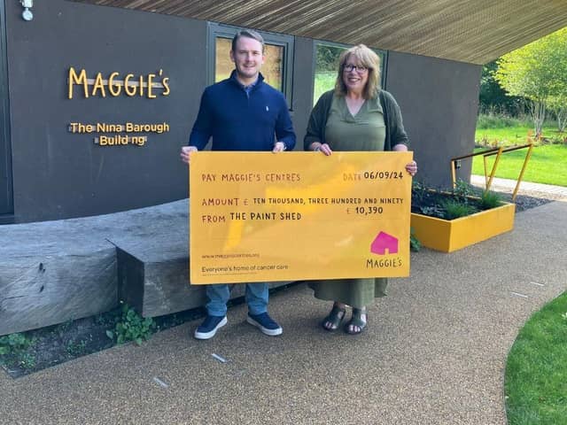 Michael Rolland presents a cheque from The Paint Shed to Maggie's Forth Valley.  (Pic: submitted)