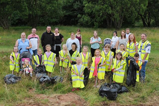 Maddiston Primary School pupils and parents gathered several bags of rubbish during a litter pick in Maddiston. Picture: Michael Gillen.