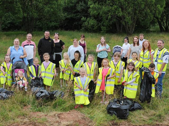 Maddiston Primary School pupils and parents gathered several bags of rubbish during a litter pick in Maddiston. Picture: Michael Gillen.
