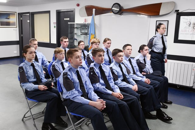 Even in classroom situations the young air cadets sit to attention.