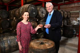 George Stewart, Falkirk Distillery owner and founder, has donated the 40th cask of Cadger's Whisky to raise vital funds for Strathcarron Hospice as part of the facility's 40th anniversary celebrations. George is pictured with Claire Kennedy, Strathcarron's corporate fundraiser. Picture: Michael Gillen.