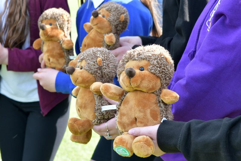 The children display their Beatie the Hedgehog mascots