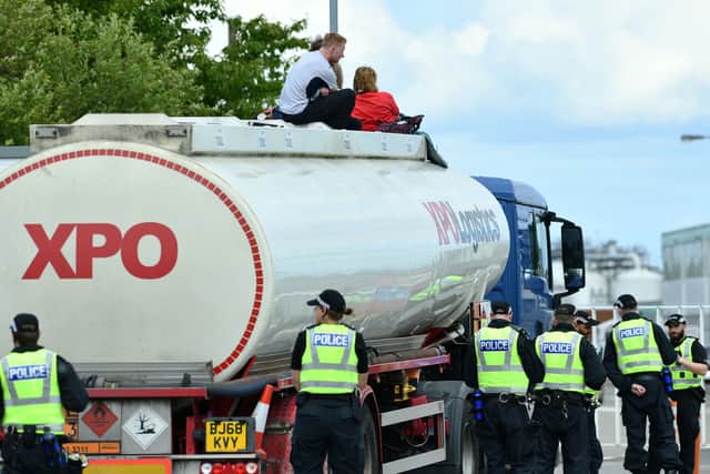 This is Rigged activists blocked the road at the Ineos oil terminal and "occupied" an oil tanker during the 2023 protest (Picture: Michael Gillen, National World)