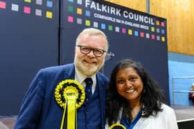 Martyn Day is congratulated on his win in Falkirk East and Linlithgow constituency by partner Nidhin Chand. Pic: Michael Gillen