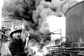 A fireman tackles the blaze at the Scottish Tar Distillers' plant at Camelon in November 1973. Pic: TSPL