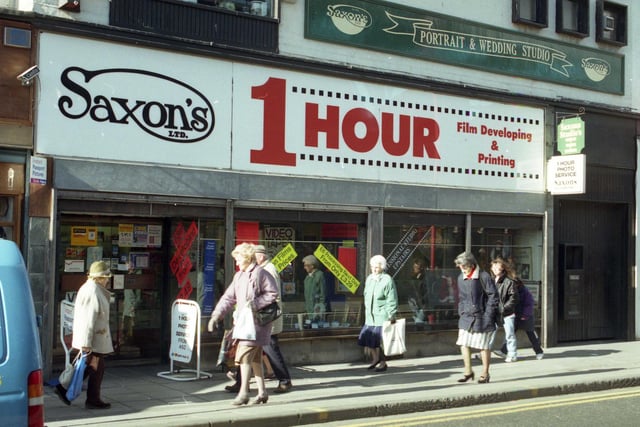 A scene from March 1997 and it shows Saxons Photographic shop in Waterloo Place. Did you get your films developed there?