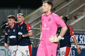 Finn Yeats and Callumn Morrison celebrate the latter scoring against Dundee United (Photo: Michael Gillen)