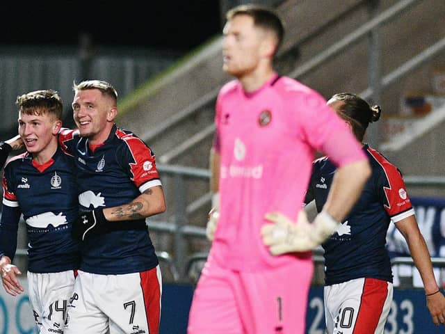Finn Yeats and Callumn Morrison celebrate the latter scoring against Dundee United (Photo: Michael Gillen)