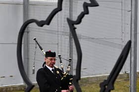 A lone piper plays during the YOI Armistice Day event