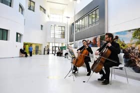 Sarah Digger and Kennedy Leitch play for staff, patients and visitors in the atrium at Forth Valley Royal Hospital.