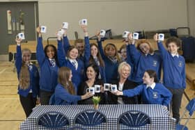 P7 pupils at Linlithgow Primary have launched a monthly Blether Cafe as a social enterprise and to raise money for the West Lothian School Clothing Bank. Pictured with pupils are LPS acting deputy headteacher Mrs Matos and Susan Wynn, sales consultant from Cala Homes (East). (Pic: Chris James)