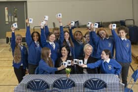 P7 pupils at Linlithgow Primary have launched a monthly Blether Cafe as a social enterprise and to raise money for the West Lothian School Clothing Bank. Pictured with pupils are LPS acting deputy headteacher Mrs Matos and Susan Wynn, sales consultant from Cala Homes (East). (Pic: Chris James)