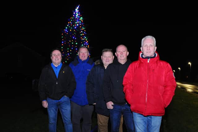 Carronshore Heritage Forum has once again paid for the community's Christmas tree and funded new festive lights.  Members of the forum with the first tree they funded in 2019.  (Pic: Michael Gillen)