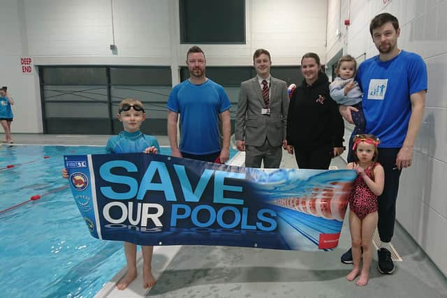 Young swimmers David, seven, and Madison, five,  join coaches Scott from Blue Star swimming, Sophie Nicol from Tryst Community Sports Club and Kieran McGuckin from Evolution Swim School with his daughter Kayla to meet Councillor Jack Redmond.