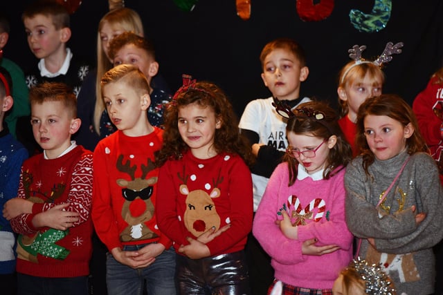 An array of colourful Christmas jumpers