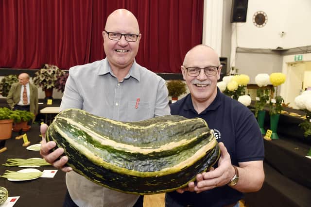 Judges Neil Muirhead and John Martin with a competitor's 1st Prize-Marrow for Weight.