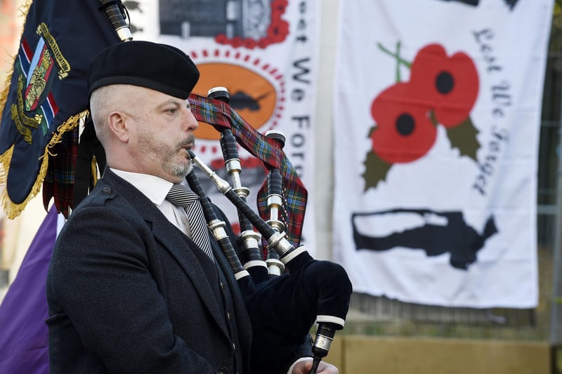 A piper played a lament at the unveiling ceremony.