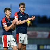 Finn Yeats applauds the Falkirk support alongside Bairns' team-mate Coll Donaldson (Photo: Michael Gillen)