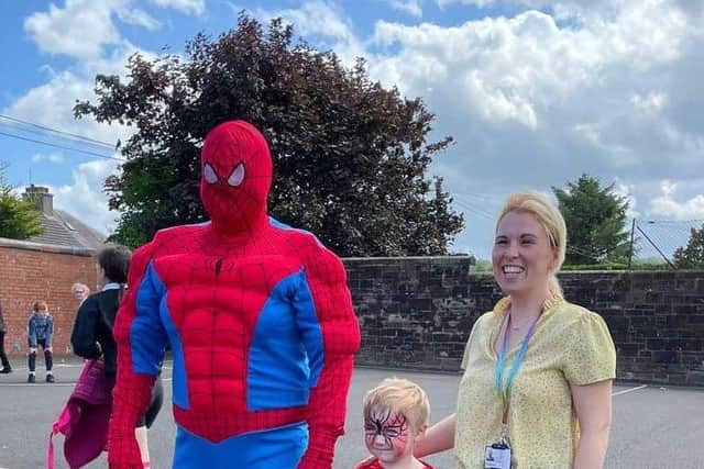Harry with Spiderman and Stephanie Duncan, an early years officer who helped organise the celebration at Carmuirs. Pic: Contributed