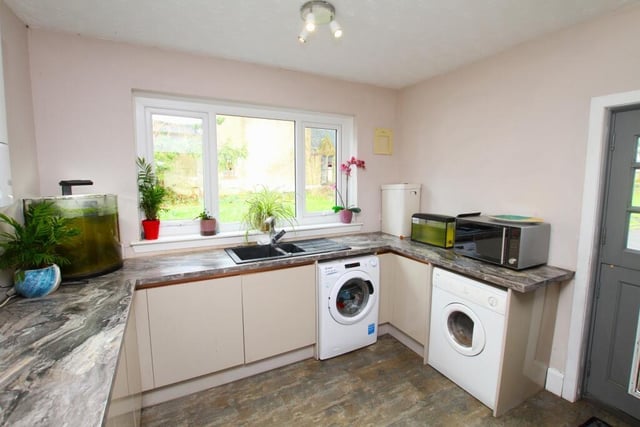 There's a utility room off the kitchen.