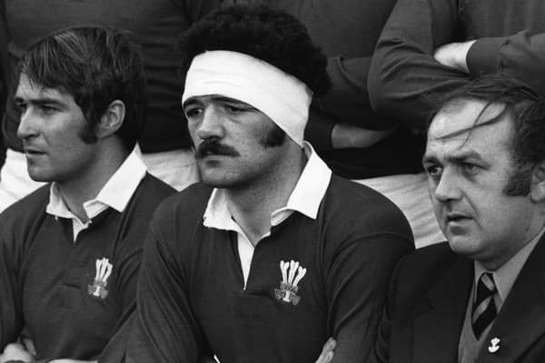 Who is this former Wales and Lions star, pictured centrally in this picture (Photo by Central Press/Hulton Archive/Getty Images)