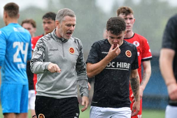 Stenhousemuir boss Gary Naysmith speaks to defender Kinlay Bilham after Saturday’s 3-2 friendly win over Bonnyrigg Rose – the Warriors face a tough start to the competitive campaign (Photo: Michael Gillen)