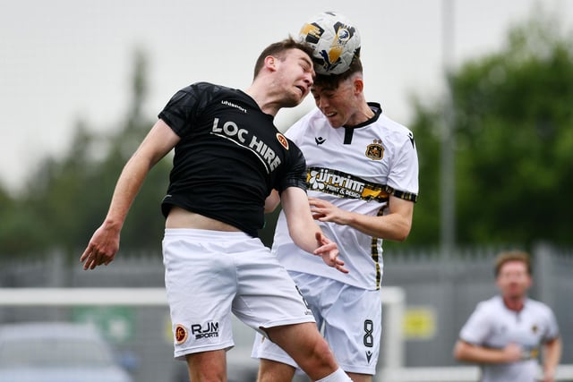 Stenny goalscorer Michael Anderson goes up for header v Sons