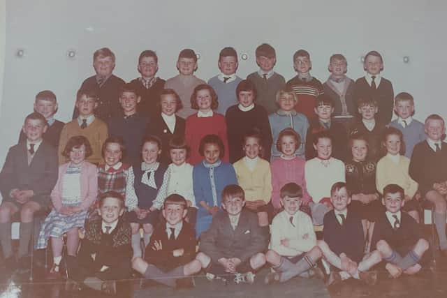 Janine Turner believes the Wallaceston Primary class photograph was taken the year the school opened in 1964 when she was eight. She is second row from the back, fourth from the left, Pic: Contributed