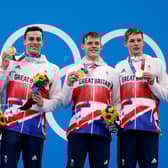 L to R: Britain's Tom Dean, James Guy, Matthew Richards and Duncan Scott pose on the podium after the final of the men's 4x200m freestyle relay swimming event (Pic: Odd Andresen/AFP via Getty Images)