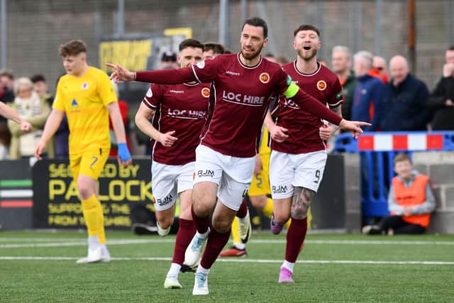 Stenhousemuir captain Gregor Buchanan wheels away to celebrate after heading the Warriors into a one-goal lead against Bonnyrigg Rose (Photo: Michael Gillen)
