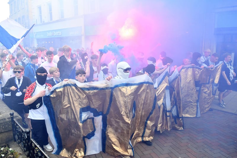 The Ultras 1876 group head to the stadium from the town centre
