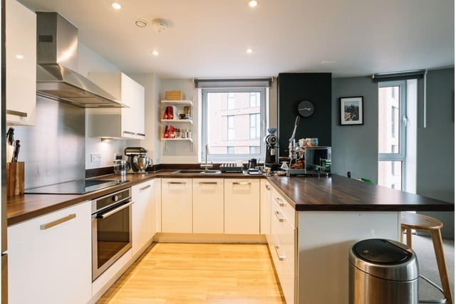 "This superior fourth floor apartment has a stunning, modern open plan living space boasting a large balcony and city views,” says the brochure.