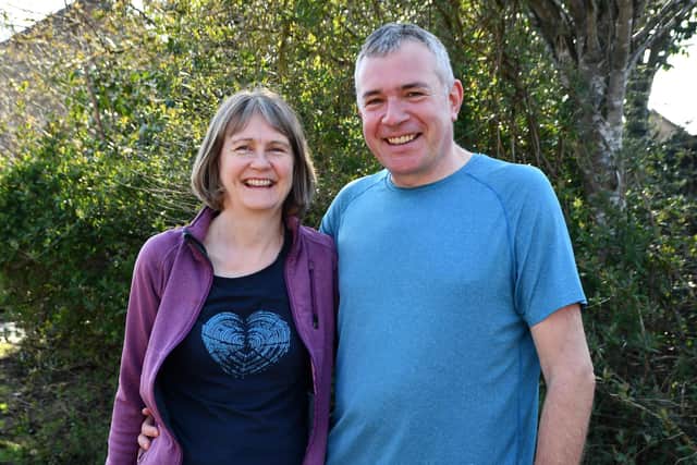 Michael and Helen Cox volunteer to walk dogs for The Cinnamon Trust.  Pic: Michael Gillen.
