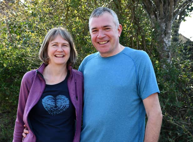Michael and Helen Cox volunteer to walk dogs for The Cinnamon Trust.  Pic: Michael Gillen.