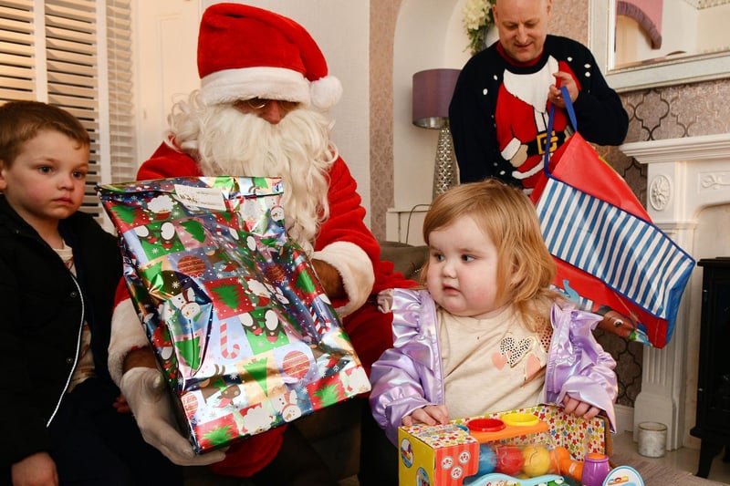 Is this all for me? Little Arya enjoys her visit from Father Christmas