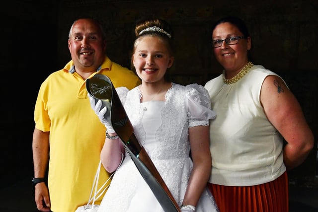 During her last week as Fair Queen Ellie Van Der Hoek,  and parents, were involved in the baton relay event