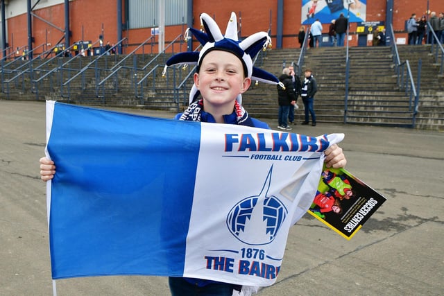 He's got the hat, the scarf, a flag and a programme ... now he needs a win.