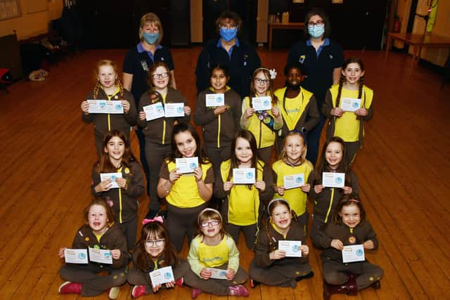 Members of the 11th Falkirk Brownies receive their skill builders badges and theme awards. Pictured with the Brownies are Claire Allan, Brownie Leader; Anne Baxter County President Forth Valley Girlguiding and Louise Fairbairn assistant Brownie Leader.  Pic: Michael Gillen.