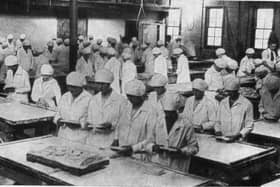Staff breaking and wrapping tablet in the early days.