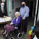 Marion Lowrie, the village's oldest resident, cut the cake to mark the official opening of California Community Hub last month, watched by Provost William Buchanan and Tom Greig, chairman of California Community Hub.b.