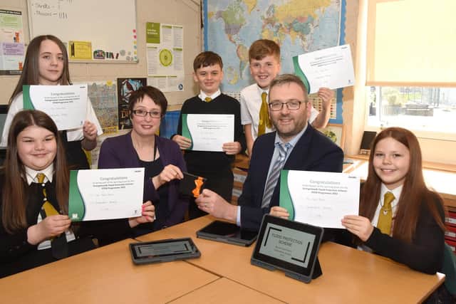 Carronshore Primary School pupils Lucy Wilcock, Finlay Campbell, Corey Russell, Darcy Kemp and Erin Miller join teacher Karen Mardon and Alistair Dawson to celebrate theri win